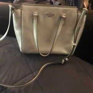 Kate spade crossbow bag with top handles for across arm carrying
